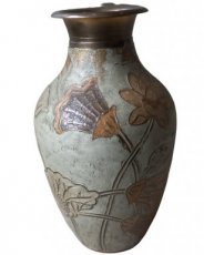 copper vase with floral decoration.
