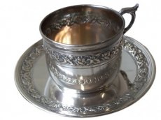 silver plated tea/coffee cup with saucer.
